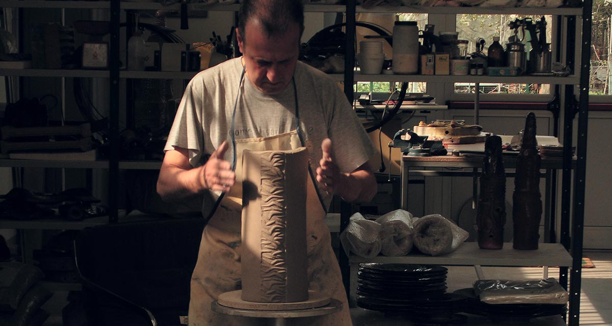 Giorgio Crisafi at the potter's wheel in his studio in Todi, Umbria