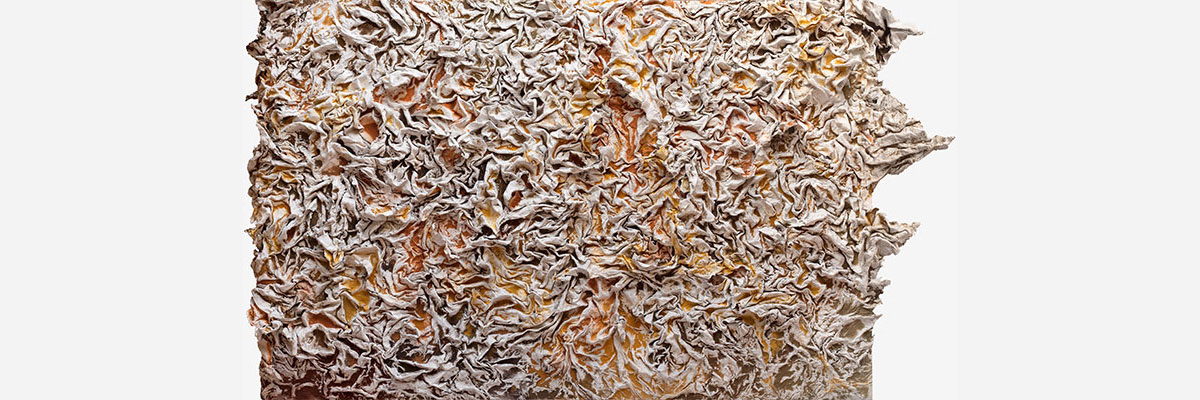 Final panel of the 42-foot relief breaking out of the picture plane onto the adjacent wall, cast recycled cardboard pulp and earth pigments. Bedford-Stuyvesant, Brooklyn, 2025.