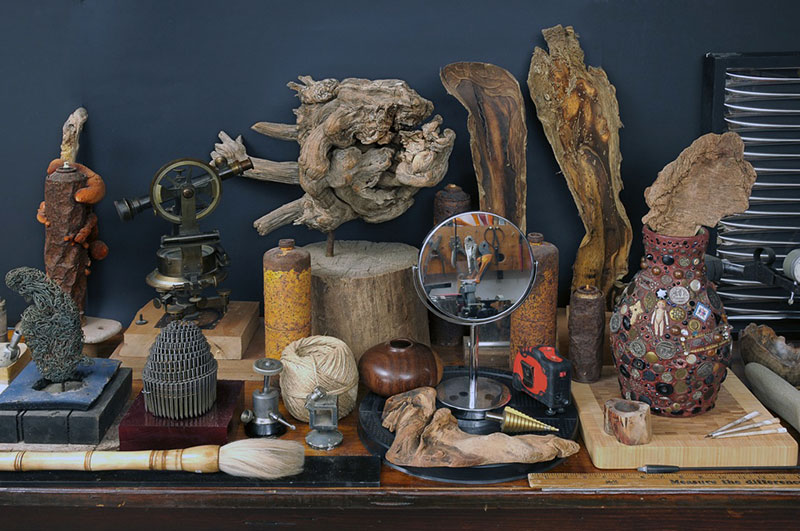The working table of the Sarteano studio where found objects are revealed by the mirror