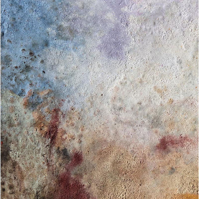 Detail of charcoal and pigment surface on archival paper showing fire-process textures in blue, violet, and ochre. Terra Bruciata 15 by Orazio De Gennaro.