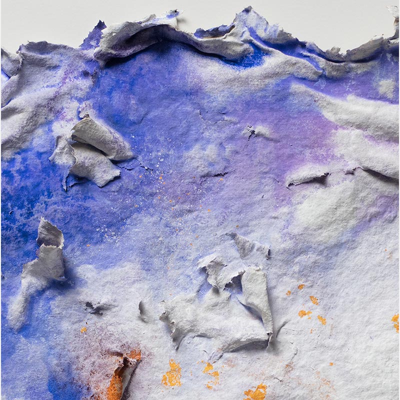 Detail of an abstract textural work on paper. Mainly blue and orange colors. Title: Lumina Brumalis