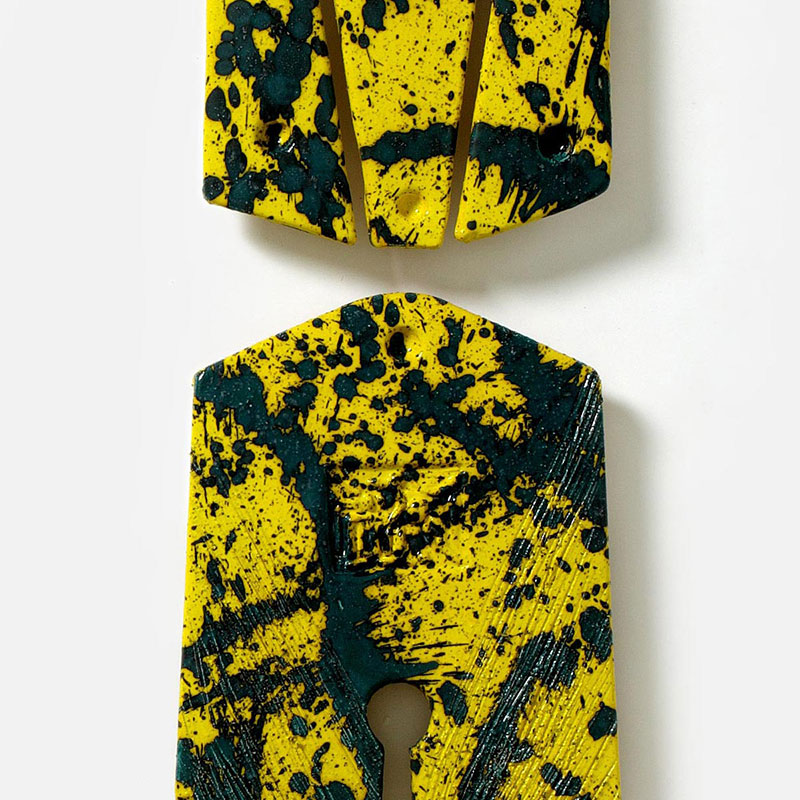 Detail of a figurative expressionist totemic sculpture by Giorgio Crisafi. Mainly yellow, black colors. Title: Bonds XIII