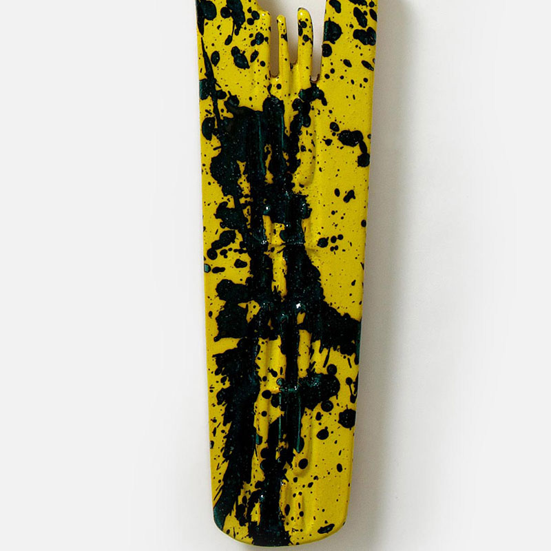 Detail of a figurative expressionist totemic sculpture by Giorgio Crisafi. Mainly yellow, black colors. Title: Bonds XIII