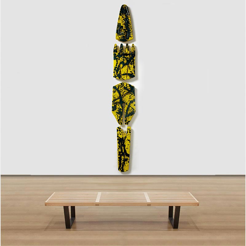 View in a room of a figurative expressionist totemic sculpture by Giorgio Crisafi. Mainly yellow, black colors. Title: Bonds XIII