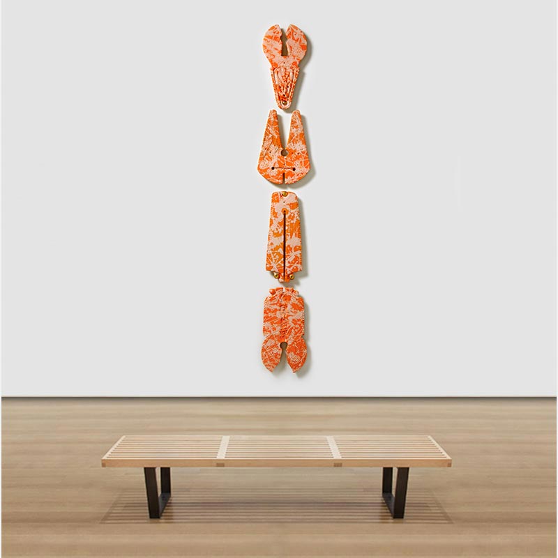 View in a room of a figurative expressionist totemic sculpture by Giorgio Crisafi. Mainly orange colors. Title: Bonds XVI