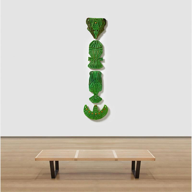 View in a room of a figurative expressionist totemic sculpture by Giorgio Crisafi. Mainly green colors. Title: Bonds IX