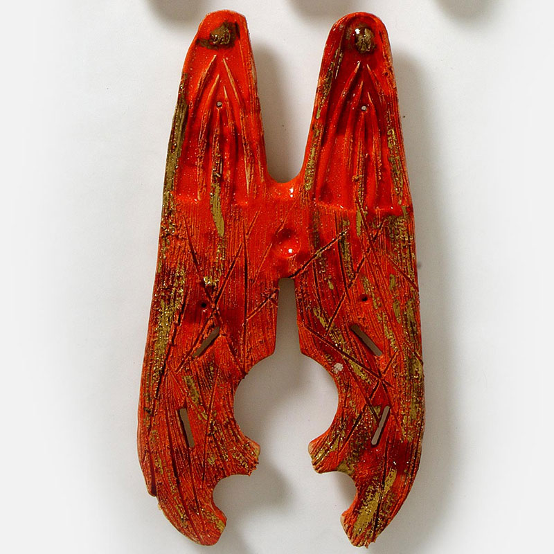 Detail of a figurative expressionist totemic sculpture by Giorgio Crisafi. Mainly red colors. Title: Bonds VII