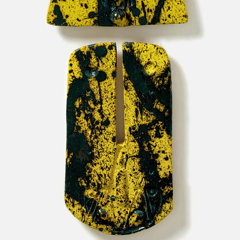 Detail of a figurative expressionist totemic sculpture by Giorgio Crisafi. Mainly yellow, black colors. Title: Bonds XX