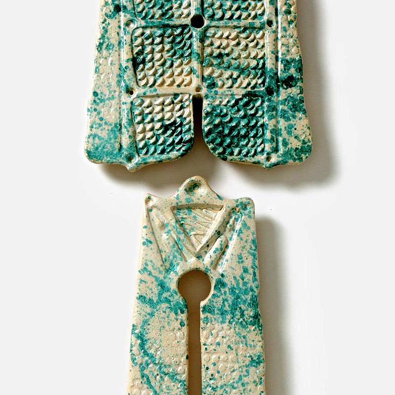 Detail of a figurative expressionist totemic sculpture by Giorgio Crisafi. Mainly grey, green colors. Title: Bonds XVIII