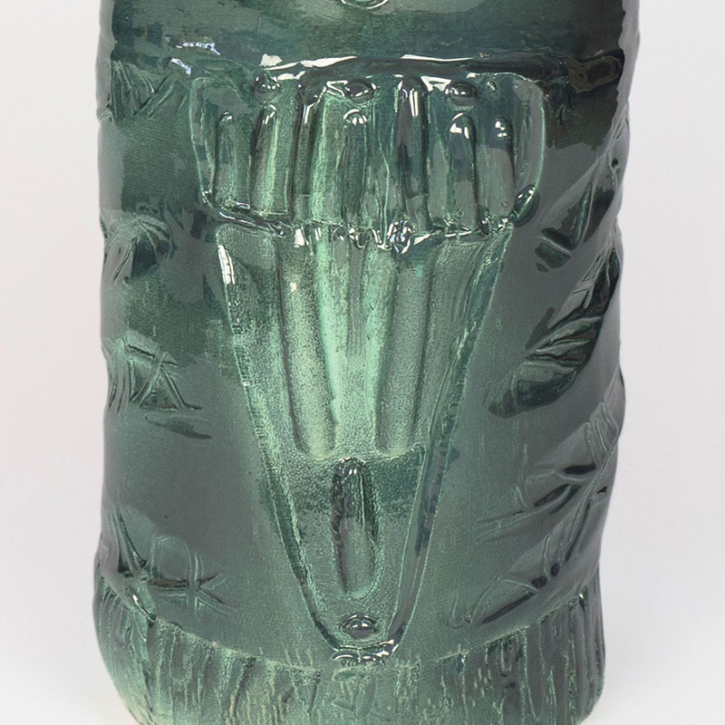 Detail of an expressionist totemic glazed ceramic sculpture by Giorgio Crisafi. Mainly green colors. Title: Apparition IV