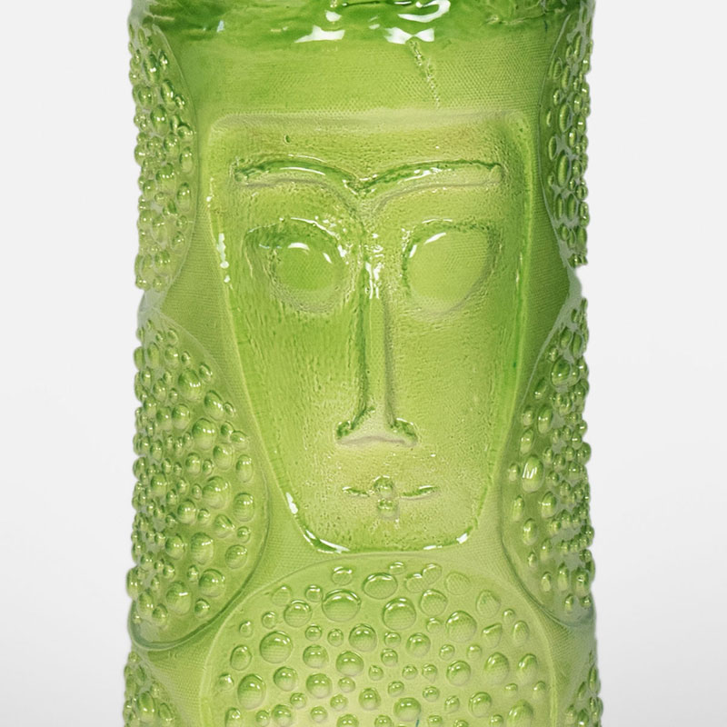 Detail of a figurative expressionist totemic glazed ceramic sculpture by Giorgio Crisafi. Mainly green, yellow colors. Title: Greengold Apparition I