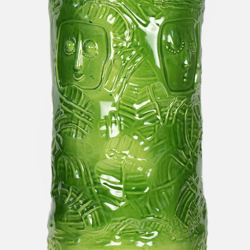 Detail of a figurative expressionist totemic glazed ceramic sculpture by Giorgio Crisafi. Mainly green, yellow colors. Title: Greengold Apparition I