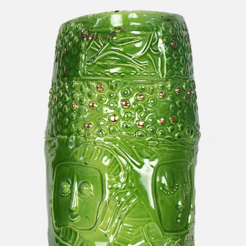 Detail of a figurative expressionist totemic glazed ceramic sculpture by Giorgio Crisafi. Mainly green, yellow colors. Title: Greengold Apparition I