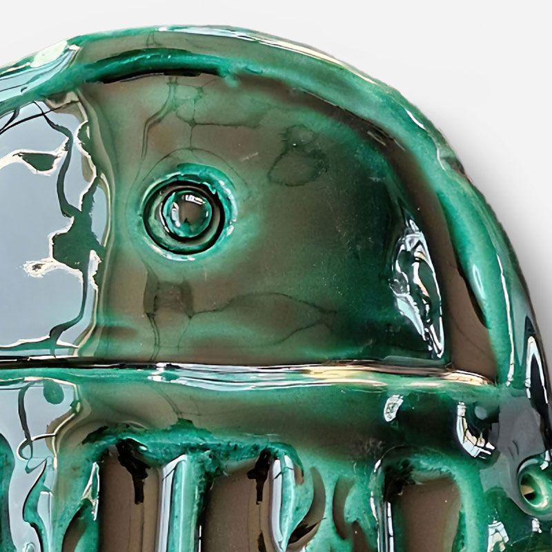 Detail of a figurative expressionist relief depicting Green Goddess Mask by Giorgio Crisafi. Mainly green colors. Title: Green Goddess Mask