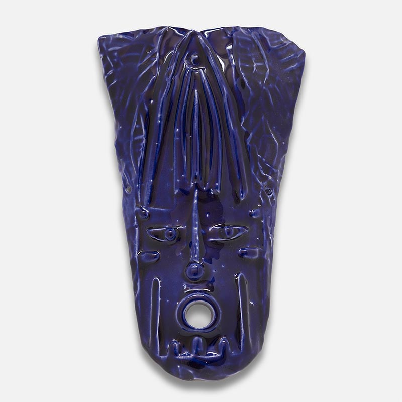 Figurative ceramic mask sculpture by Giorgio Crisafi, deep ultramarine blue glaze with vertical draped texture, Masks series. Title: Maschera Blu II